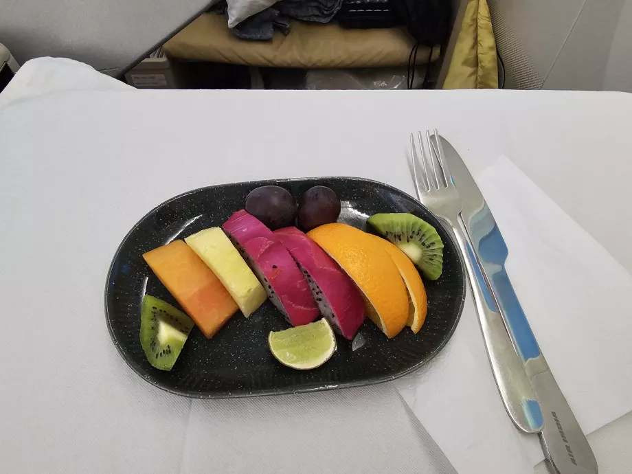 Fruktskål, flyg DEL-MXP